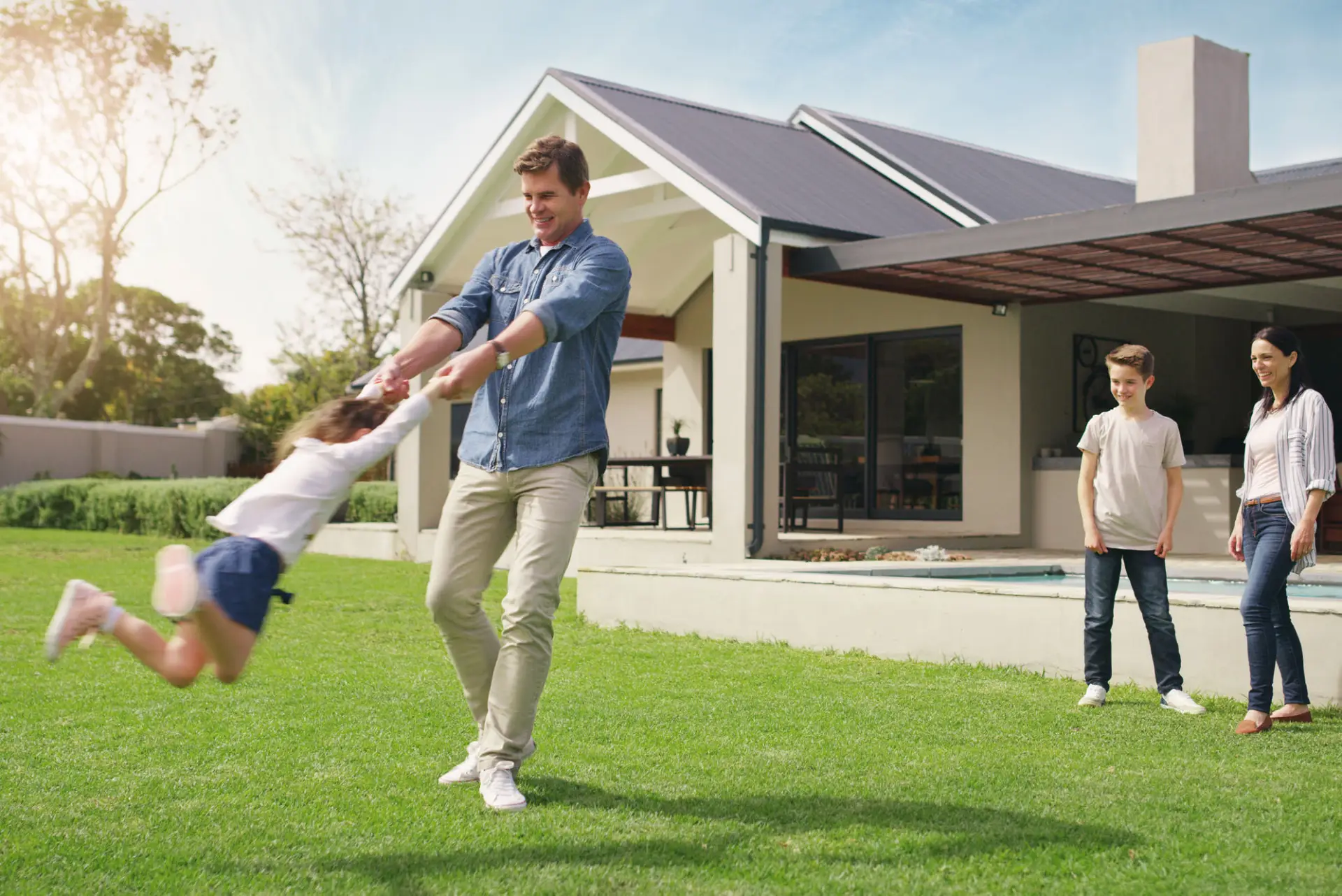 Family enjoying time together in their garden – Jumbo Home Loan lifestyle