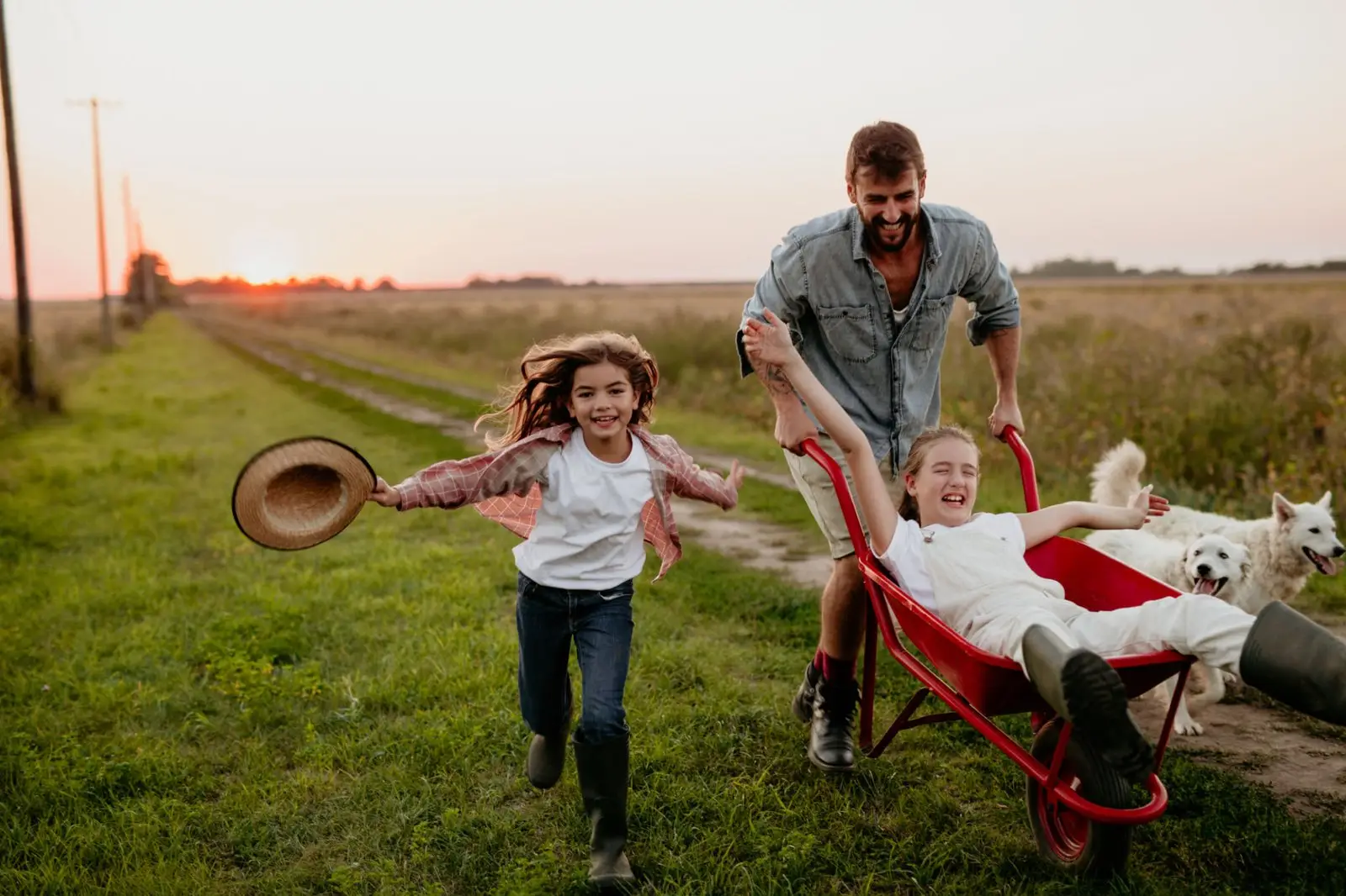 Happy family running through a rural field – USDA Home Loan lifestyle